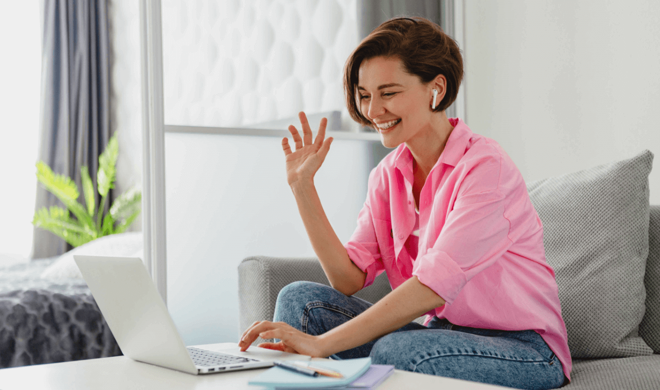 A female employee video conferencing in a hybrid workplace