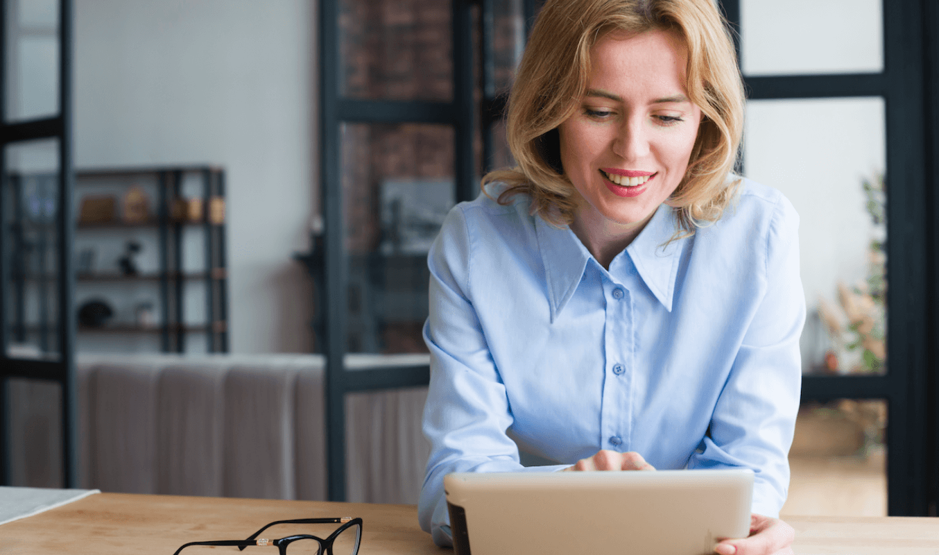 An administrator using a tablet to work at home