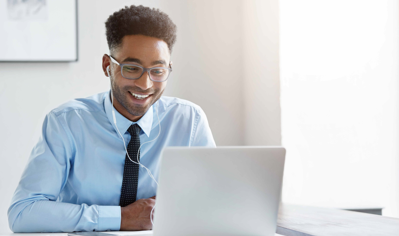 A male member attending a virtual meeting for nonprofits with a laptop